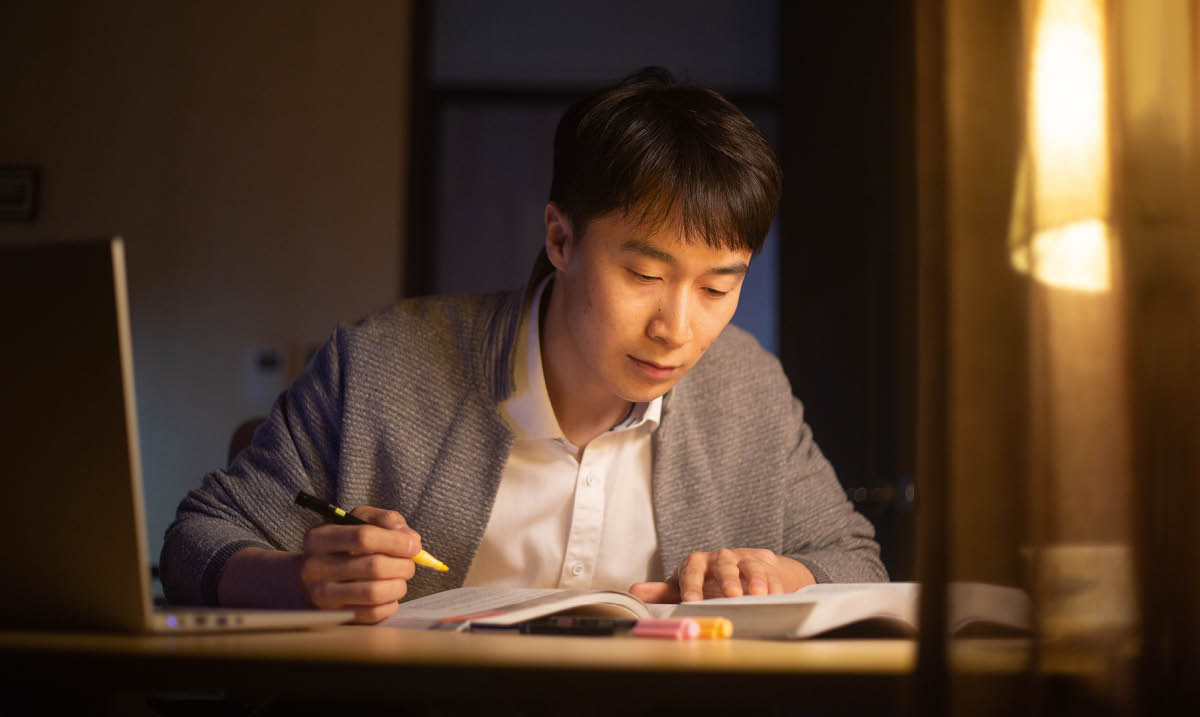 A young brother preparing for a Bible study using “Enjoy Life Forever!”