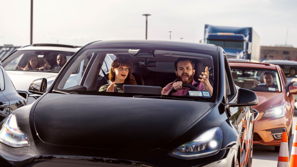 An angry brother in traffic, yelling at another driver while his wife tries to calm him down.