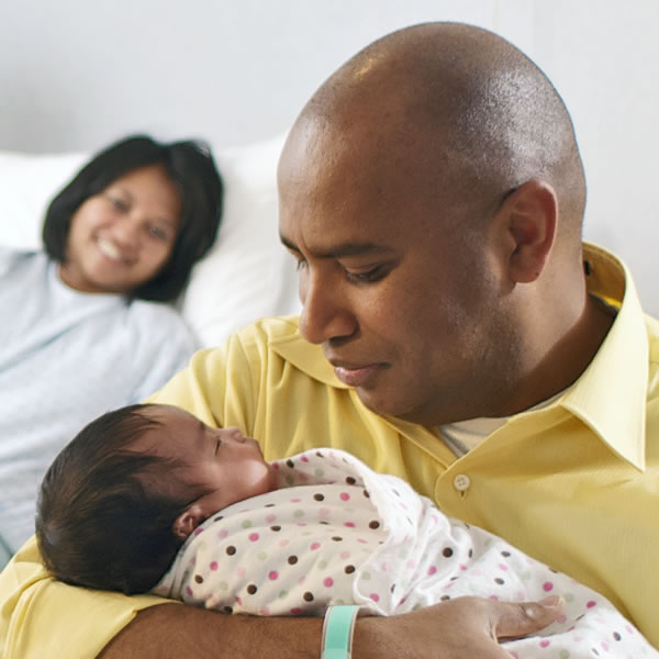 Parents with their newborn baby