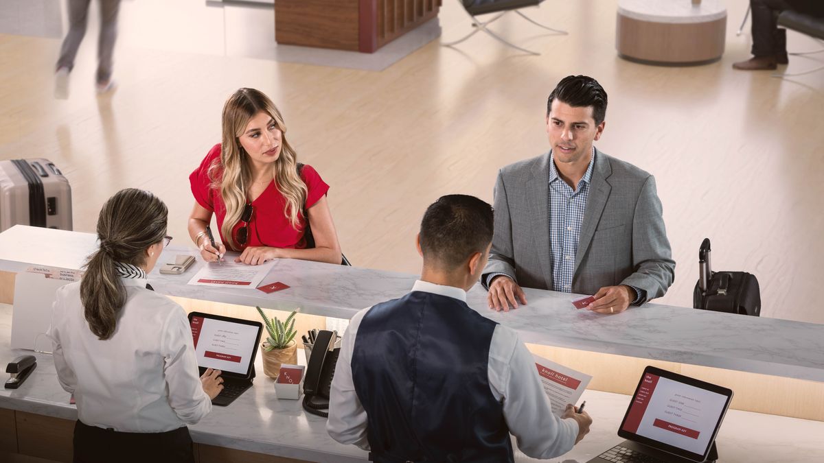 A young married brother on a business trip checking into a hotel. An attractive young non-Witness woman, checking in at the same time, stares over at him.