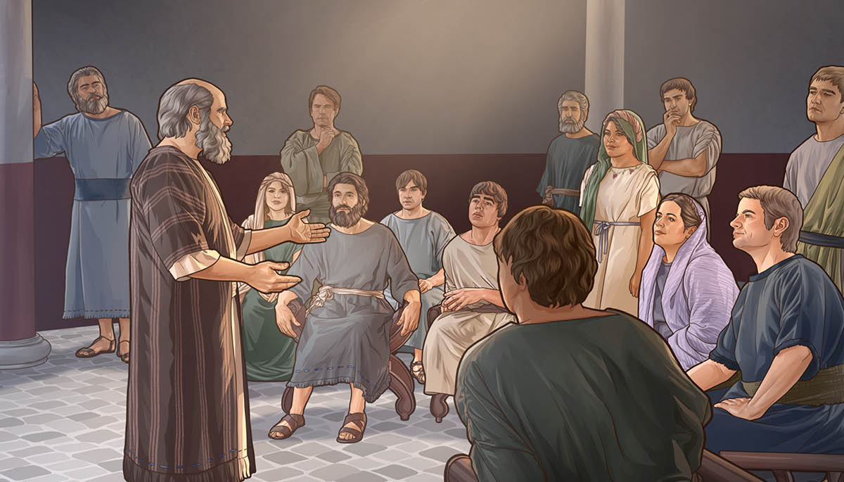 The apostle Paul sharing the good news with a group of people in a school auditorium.